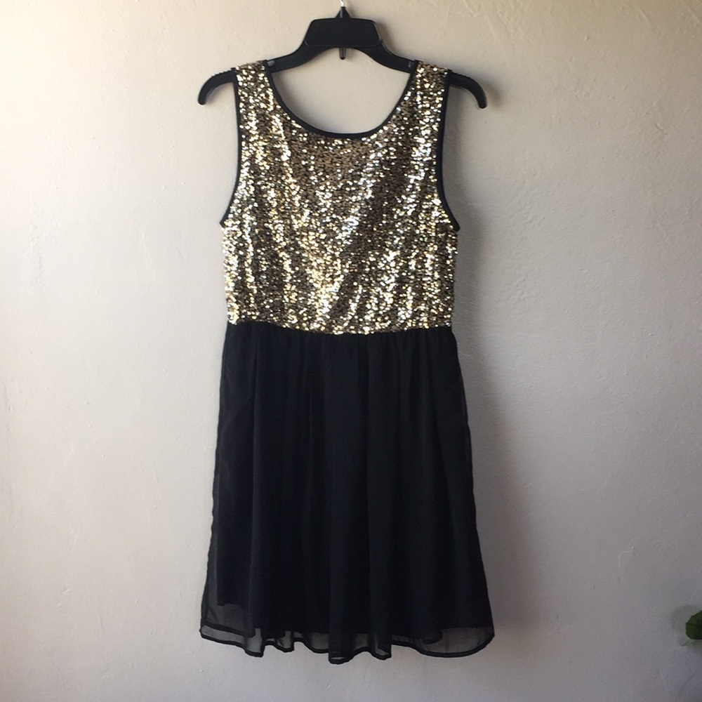 Perfect gold and black New Year’s Eve dress